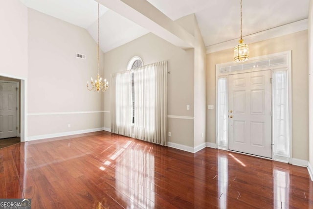 4838 Netherlands Pl, Flowery Branch, GA 30542 - entrance foyer with a chandelier, wood finished floors, and high vaulted ceiling