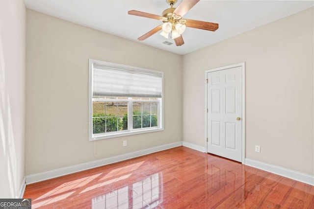 4838 Netherlands Pl, Flowery Branch, GA 30542 - unfurnished bedroom featuring wood finished floors and a ceiling fan