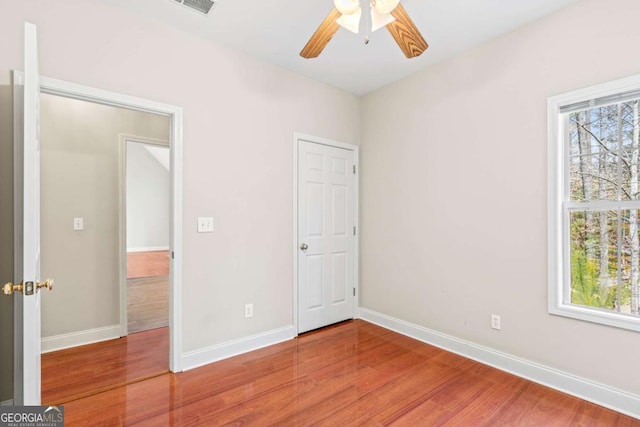 4838 Netherlands Pl, Flowery Branch, GA 30542 - unfurnished bedroom with wood finished floors and a ceiling fan