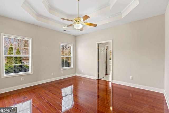 4838 Netherlands Pl, Flowery Branch, GA 30542 - spare room with crown molding, a raised ceiling, wood finished floors, and a ceiling fan