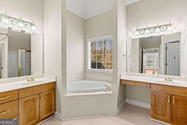 4838 Netherlands Pl, Flowery Branch, GA 30542 - bathroom with a shower stall, two vanities, a garden tub, and tile patterned floors