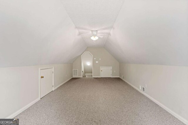 4838 Netherlands Pl, Flowery Branch, GA 30542 - additional living space featuring carpet floors, ceiling fan, and lofted ceiling