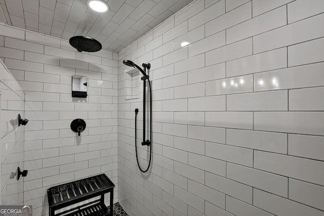 full bathroom featuring tiled shower