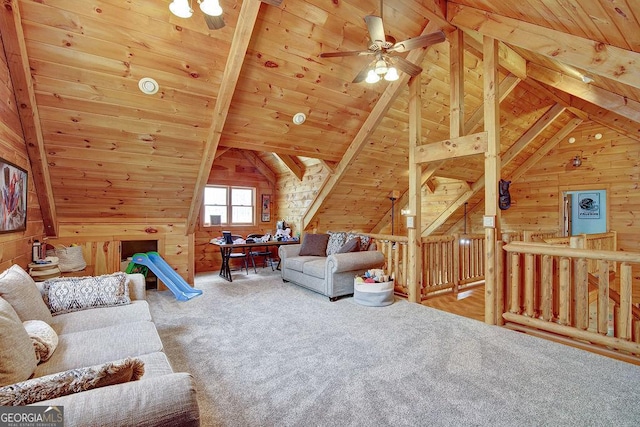 carpeted living area featuring wooden ceiling, a ceiling fan, and wood walls