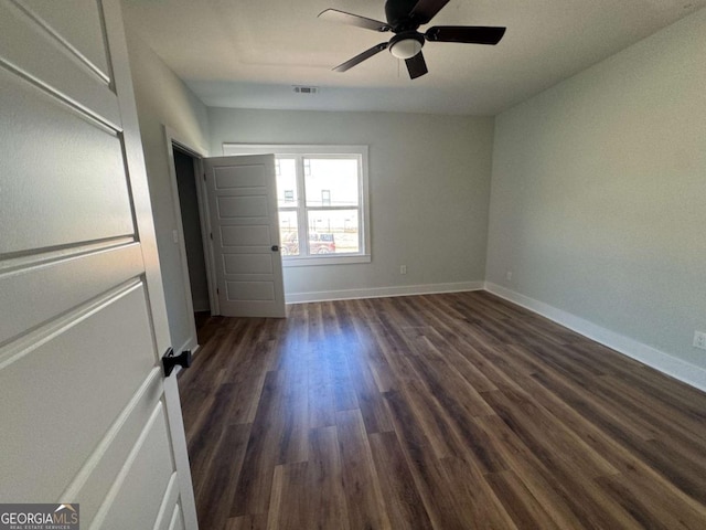 1510 Olympian Way SW, Atlanta, GA 30310 - unfurnished bedroom featuring dark wood finished floors and ceiling fan
