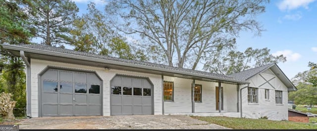 view of front of home featuring an attached garage and driveway