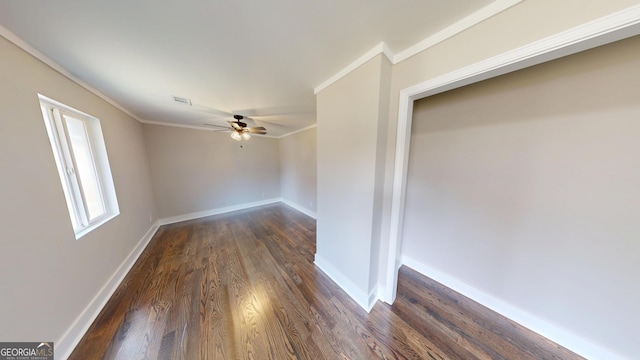 spare room with visible vents, baseboards, a ceiling fan, and ornamental molding