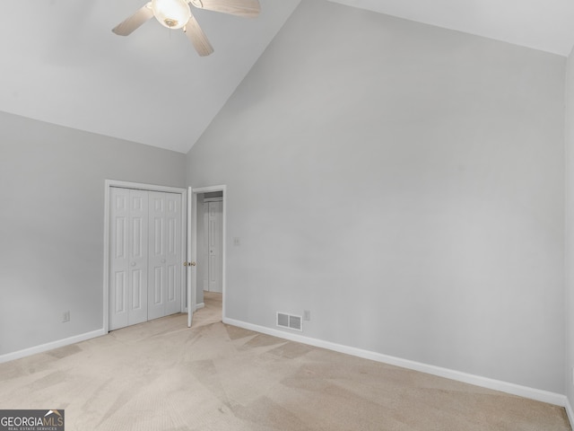 1300 Lakehaven Pkwy, Mcdonough, GA 30253 - unfurnished bedroom featuring high vaulted ceiling, light carpet, a ceiling fan, and a closet
