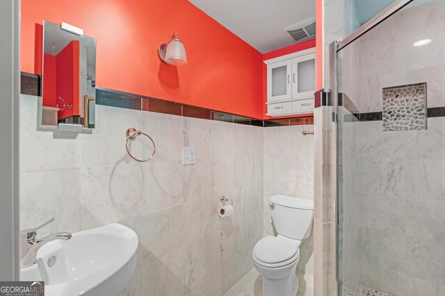 1300 Lakehaven Pkwy, Mcdonough, GA 30253 - bathroom featuring a stall shower and tile walls