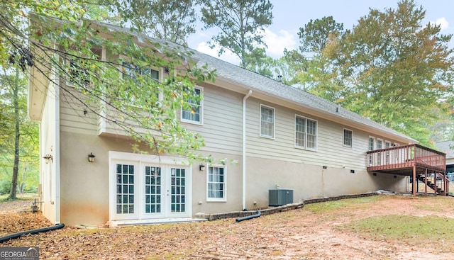 1300 Lakehaven Pkwy, Mcdonough, GA 30253 - rear view of house featuring a wooden deck, stairway, french doors, stucco siding, and a shingled roof