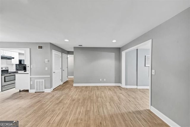 117 Lablanc Way NW, Atlanta, GA 30327 - unfurnished living room featuring light wood finished floors, visible vents, recessed lighting, and baseboards