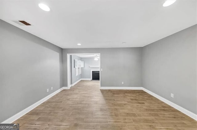 117 Lablanc Way NW, Atlanta, GA 30327 - unfurnished living room with recessed lighting, wood finished floors, visible vents, and baseboards