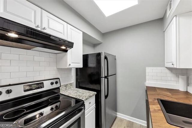 117 Lablanc Way NW, Atlanta, GA 30327 - kitchen with white cabinetry, decorative backsplash, under cabinet range hood, and stainless steel appliances