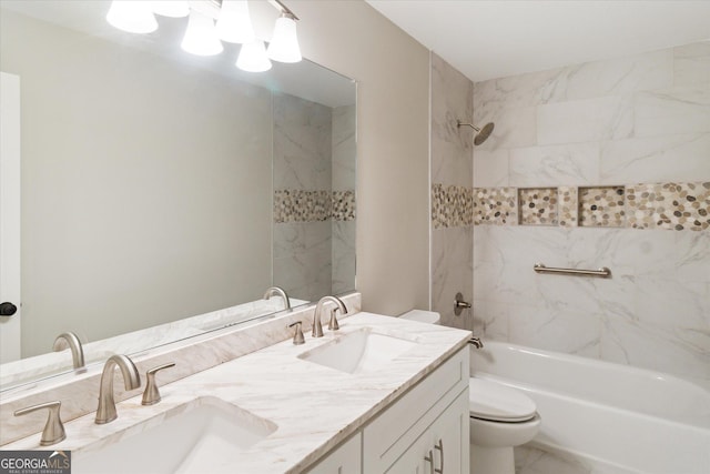 full bath featuring double vanity, toilet, shower / washtub combination, and a sink