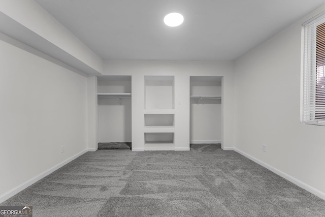 4304 Ruth Ln, Powder Springs, GA 30127 - unfurnished bedroom with baseboards, multiple closets, and carpet flooring
