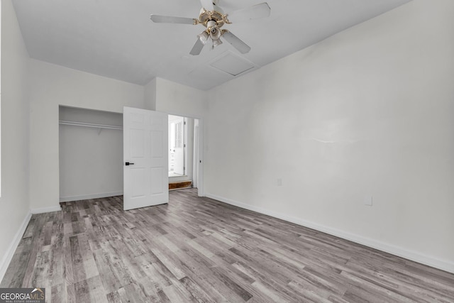 4304 Ruth Ln, Powder Springs, GA 30127 - unfurnished bedroom with a closet, attic access, wood finished floors, baseboards, and ceiling fan