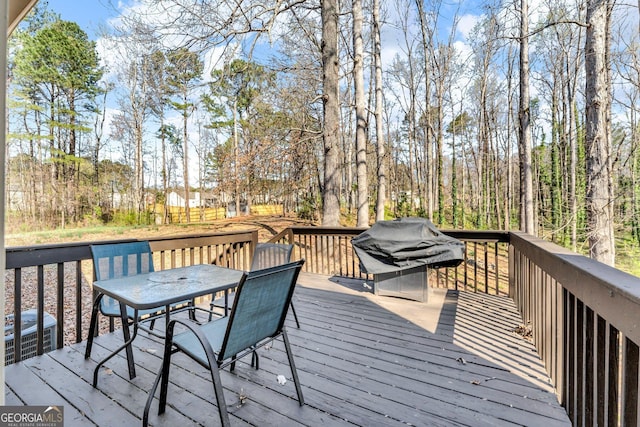 4304 Ruth Ln, Powder Springs, GA 30127 - wooden deck featuring a grill and outdoor dining area
