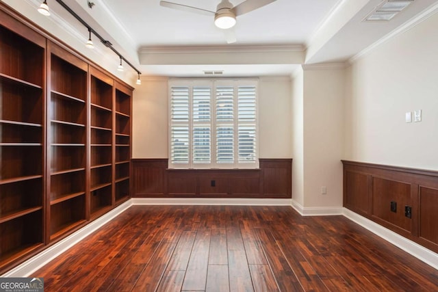 unfurnished room featuring visible vents, ceiling fan, crown molding, and hardwood / wood-style flooring