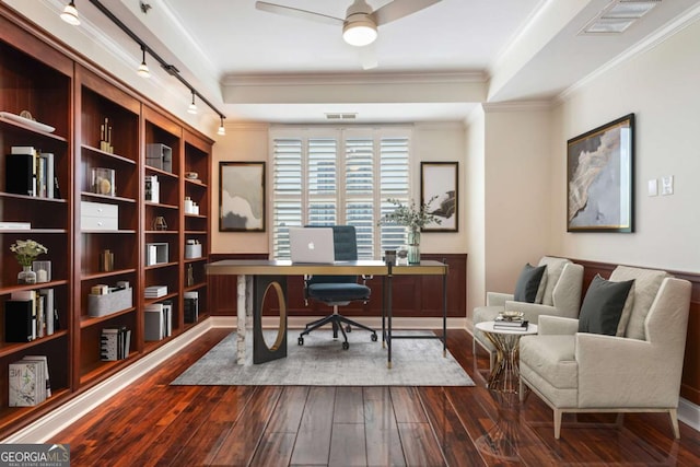 office with visible vents, dark wood-style flooring, a ceiling fan, and crown molding