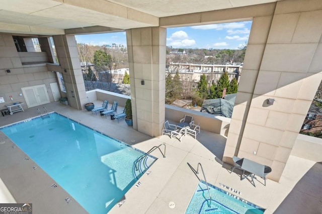 view of pool featuring a patio