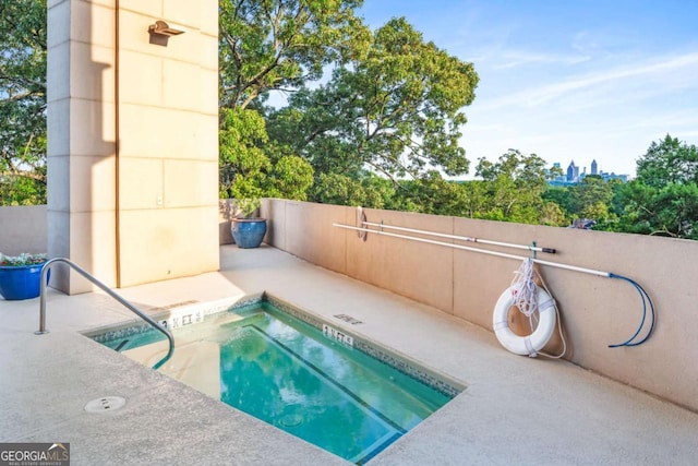 view of swimming pool with a patio