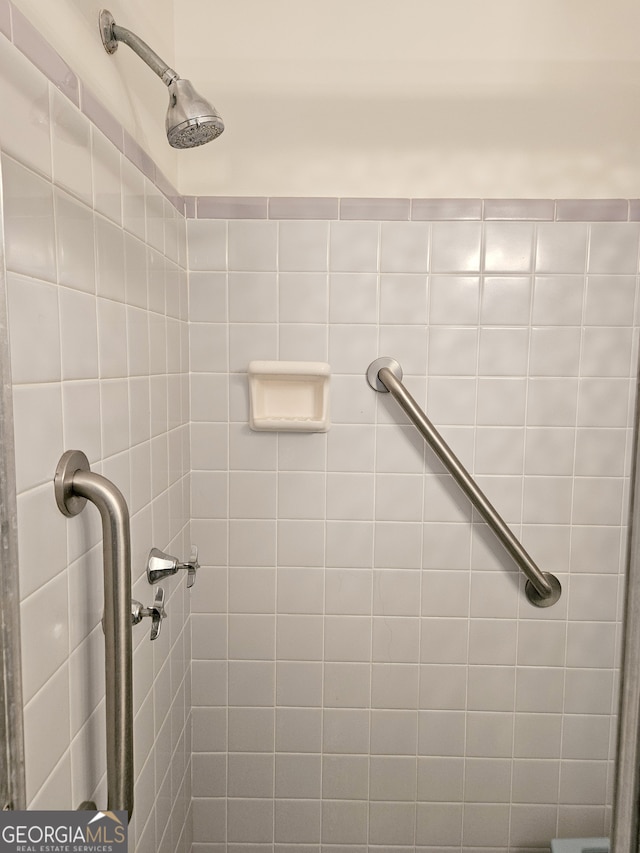 bathroom with a tile shower