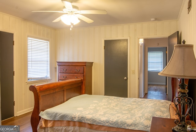 bedroom with a ceiling fan and wood finished floors