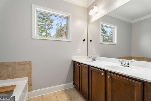 full bathroom featuring a wealth of natural light, a sink, and crown molding
