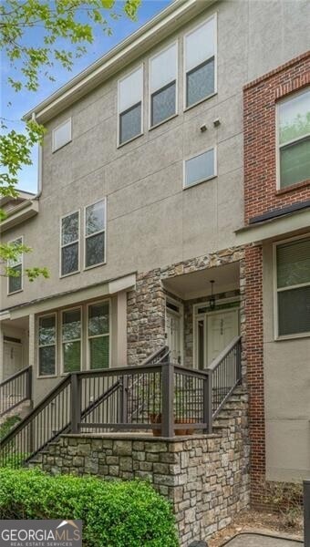 back of property with stucco siding