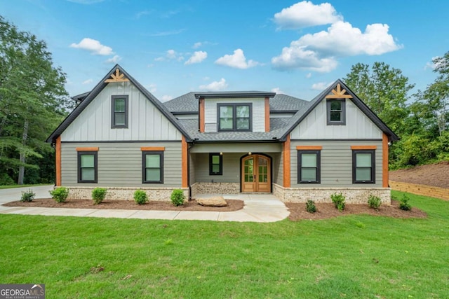 303 Tumbling Shoals Ct, Gray, GA 31032 - view of front of property featuring french doors, roof with shingles, board and batten siding, and a front yard