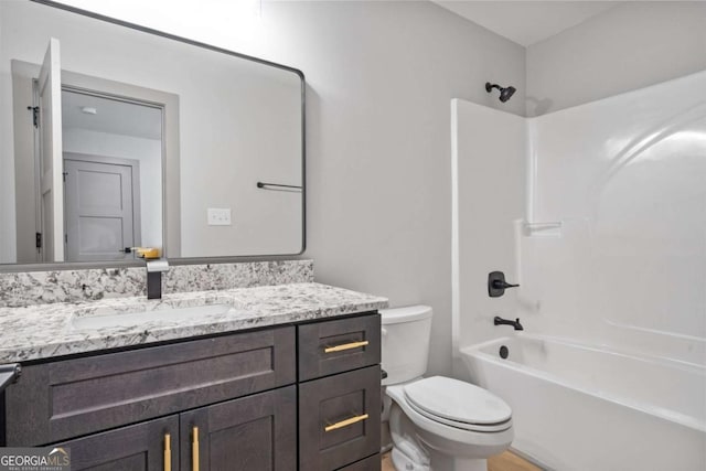303 Tumbling Shoals Ct, Gray, GA 31032 - bathroom with toilet, vanity, and shower / tub combination