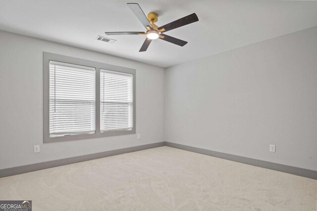 303 Tumbling Shoals Ct, Gray, GA 31032 - carpeted empty room featuring baseboards, visible vents, and ceiling fan