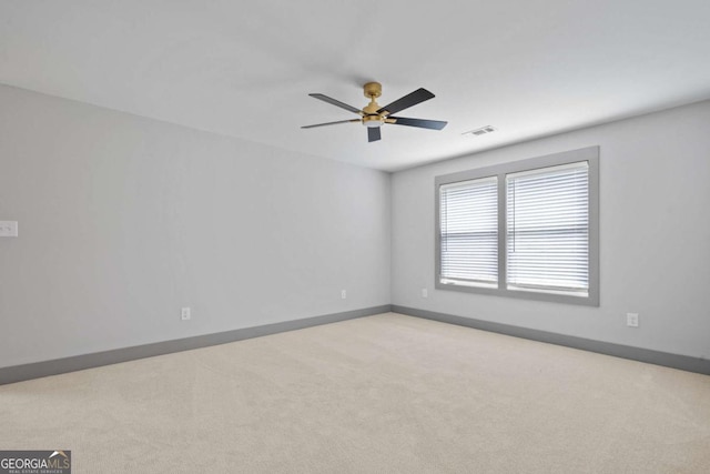 303 Tumbling Shoals Ct, Gray, GA 31032 - carpeted spare room featuring baseboards, visible vents, and ceiling fan