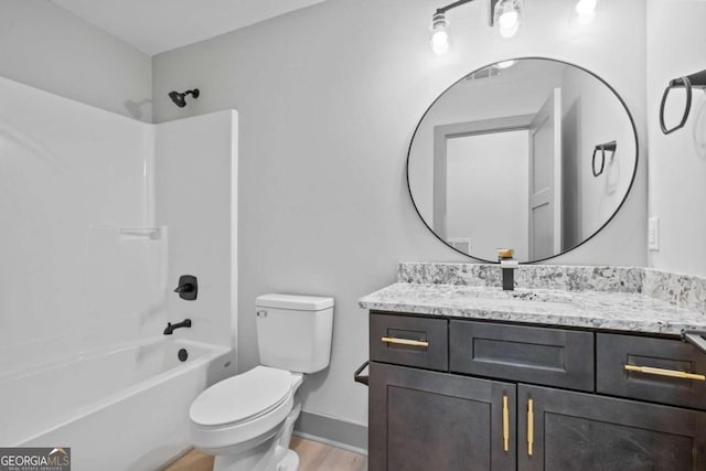 303 Tumbling Shoals Ct, Gray, GA 31032 - full bathroom with tub / shower combination, baseboards, toilet, wood finished floors, and vanity