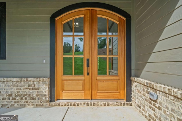 303 Tumbling Shoals Ct, Gray, GA 31032 - property entrance featuring french doors and a porch