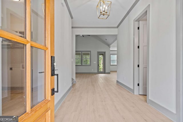 303 Tumbling Shoals Ct, Gray, GA 31032 - entryway with baseboards, lofted ceiling, crown molding, light wood-type flooring, and a chandelier
