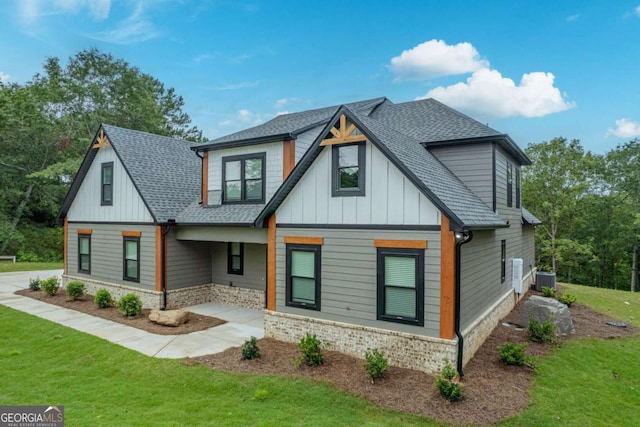 303 Tumbling Shoals Ct, Gray, GA 31032 - view of front of house featuring board and batten siding, a front yard, and a shingled roof