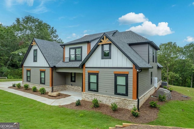 303 Tumbling Shoals Ct, Gray, GA 31032 - view of front of property with board and batten siding, a front lawn, and roof with shingles