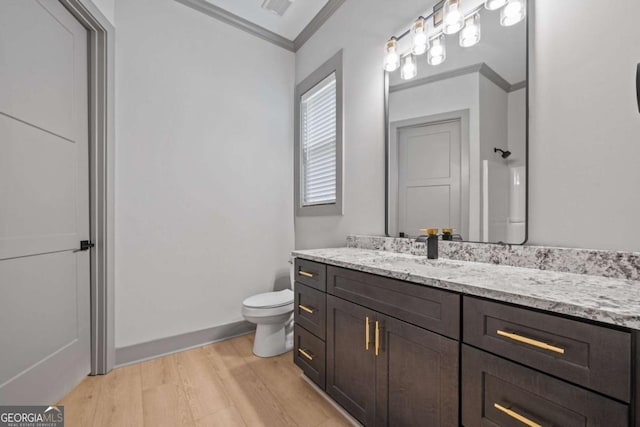 303 Tumbling Shoals Ct, Gray, GA 31032 - bathroom featuring visible vents, toilet, ornamental molding, wood finished floors, and vanity