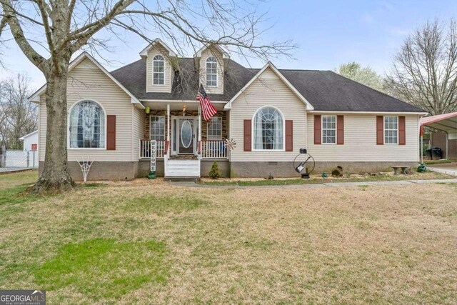 22 Valley Creek Dr SW, Cartersville, GA 30120 - cape cod house featuring a shingled roof, a carport, covered porch, crawl space, and a front lawn