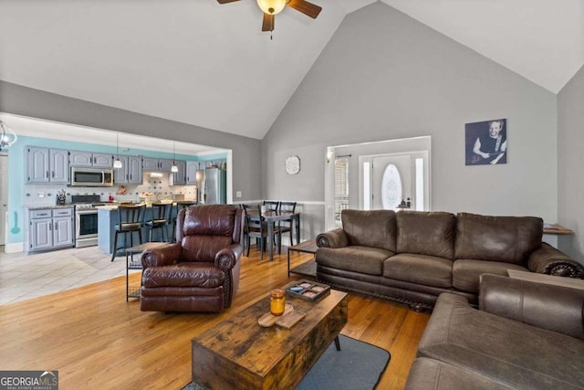 22 Valley Creek Dr SW, Cartersville, GA 30120 - living area with high vaulted ceiling, a ceiling fan, and light wood finished floors