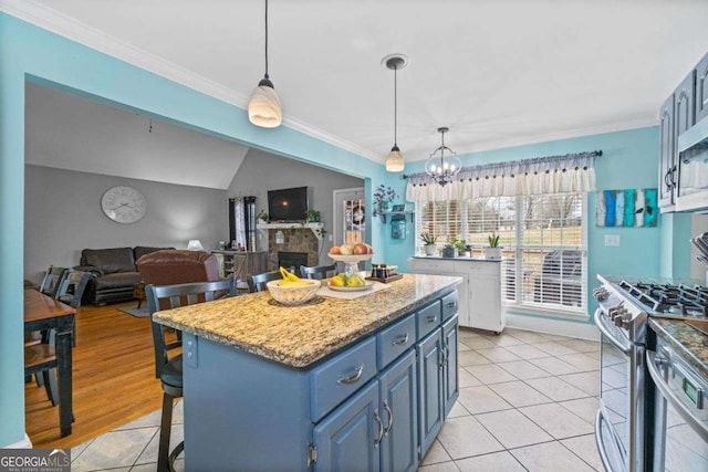 22 Valley Creek Dr SW, Cartersville, GA 30120 - kitchen featuring ornamental molding, stainless steel range with gas stovetop, a notable chandelier, and blue cabinets