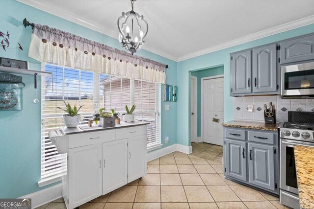 22 Valley Creek Dr SW, Cartersville, GA 30120 - kitchen with crown molding, gray cabinets, a chandelier, appliances with stainless steel finishes, and decorative backsplash