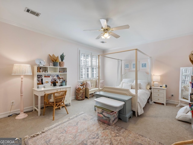 carpeted bedroom featuring baseboards, visible vents, and ornamental molding