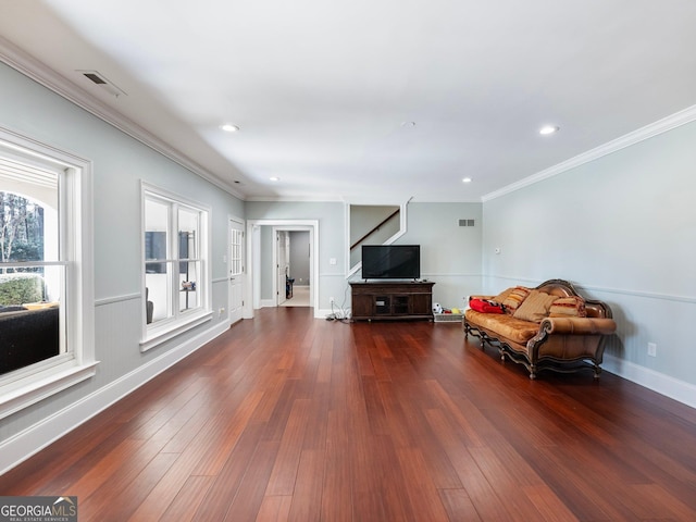 living area with dark wood-style flooring, visible vents, recessed lighting, and crown molding