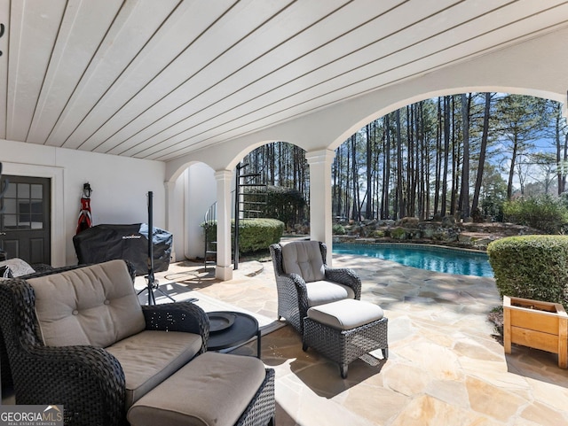 view of patio / terrace featuring an outdoor pool