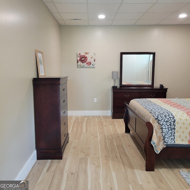 107 Oak Way Dr, Eastanollee, GA 30538 - bedroom with visible vents, baseboards, light wood-type flooring, and a paneled ceiling