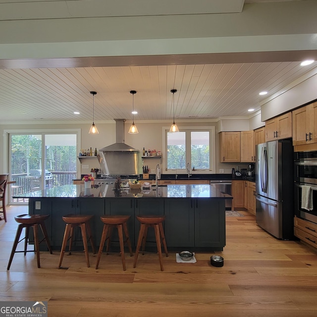 107 Oak Way Dr, Eastanollee, GA 30538 - kitchen with a breakfast bar, a sink, appliances with stainless steel finishes, dark countertops, and wall chimney exhaust hood