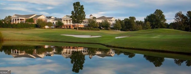1653 Georgia Club Dr, Statham, GA 30666 - surrounding community with golf course view, a water view, and a lawn