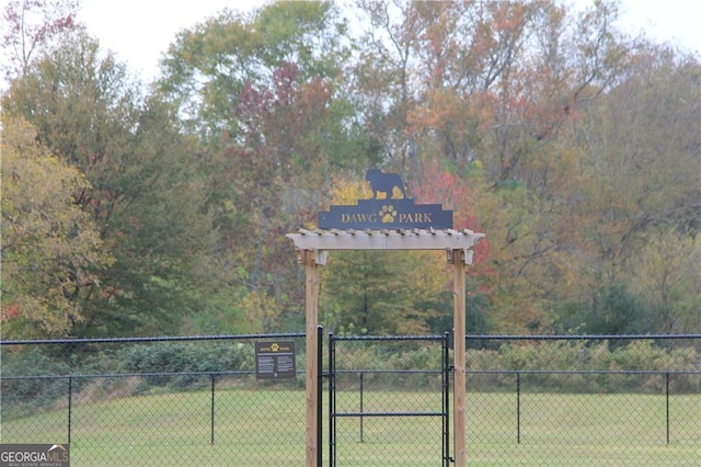 1653 Georgia Club Dr, Statham, GA 30666 - view of street featuring a gate
